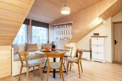 a kitchen and dining room with a table and chairs at Luxury apartment in Gedimino av. in Vilnius