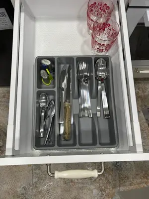 a tray with silver utensils in a refrigerator at City Life in Vilnius