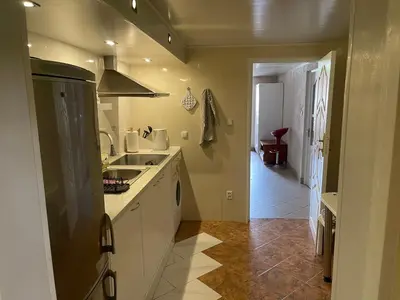 a kitchen with a sink and a counter at Guest House Vilnius in Vilnius
