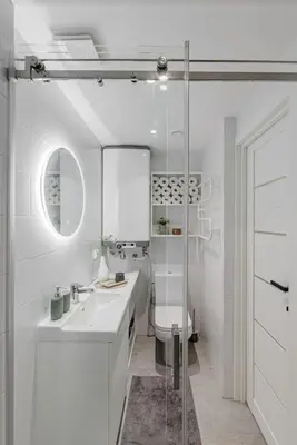 a white bathroom with a sink and a toilet at Modern Loft Walk to Center Fast Wi-Fi in Vilnius