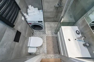 a small bathroom with a toilet and a sink at Shanti barracks apartment by Polo Apartments in Kaunas