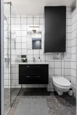 a bathroom with a sink and a toilet at River To The City - Self check in in Vilnius