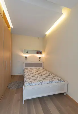 a bedroom with a white bed in a room at Deluxe river view apartment by Polo Apartment in Kaunas