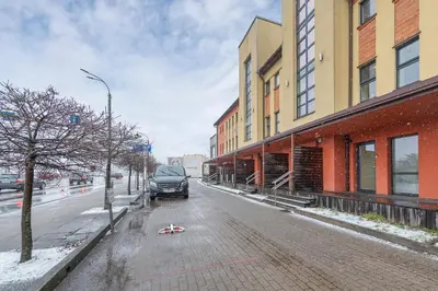 a car parked on a city street in the snow at Deluxe river view apartment by Polo Apartment in Kaunas