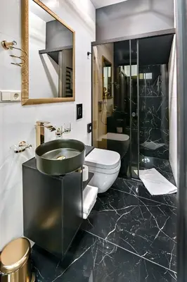 a bathroom with a sink and a toilet at Diamond svečių namai in Kaunas