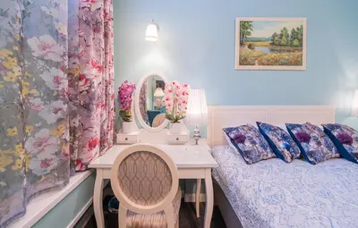 a bedroom with a bed and a desk with a mirror at Station Self Check-in Apartments - Lollo Stay in Vilnius