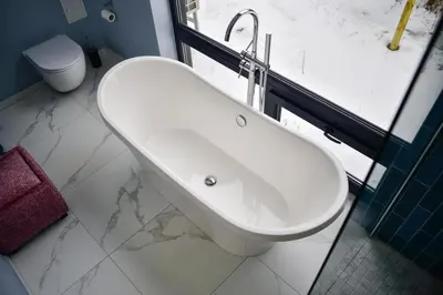 a bathroom with a white sink and a toilet at Aušrinės in Liškiava