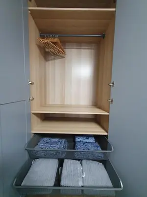 a cupboard with two towels in a refrigerator at City apartment 2 bedrooms in Šiauliai