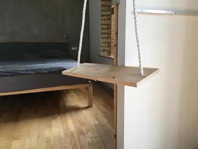 a room with a bed and a swing at 4Work & Leisure I SELF-CHECKIN I 3PARKING I CENTRAL STATION DISTRICT - simpletone in Vilnius