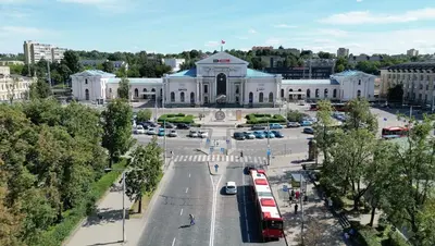 a large white building with a street in front of it at 4Work & Leisure I SELF-CHECKIN I 3PARKING I CENTRAL STATION DISTRICT - simpletone in Vilnius