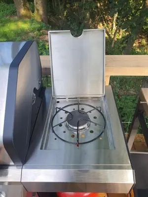 a stove top oven sitting on top of a table at 