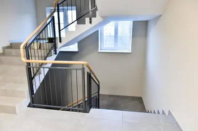 a staircase in a house with a window at Mickeviciaus 11-11 in Šiauliai
