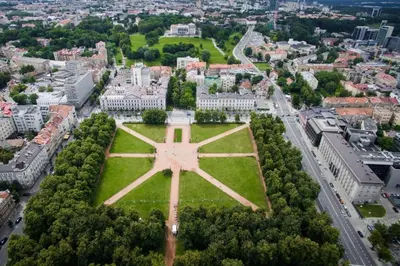 an aerial view of the city of vienna with a large cross in the grass at Spacious City Centre Apartment with Parking SELF CHECK-IN in Vilnius