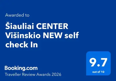 a blue sign that readsatal center vyssida new self check in at Šiauliai CENTER Višinskio NEW self check In in Šiauliai