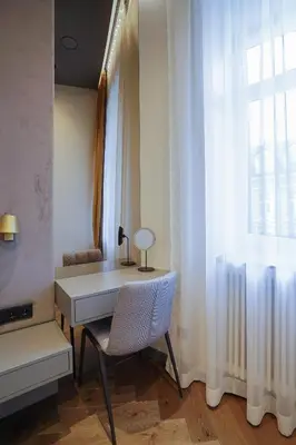 a room with a table and a chair and a window at Forentinn Gedimino pr. in Vilnius