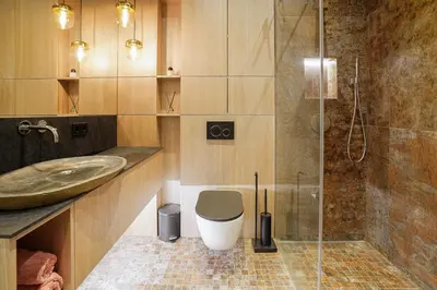 a bathroom with a shower and a toilet and a sink at Forentinn Gedimino pr. in Vilnius