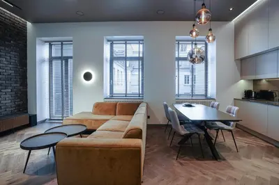 a living room with a couch and a table at Forentinn Gedimino pr. in Vilnius