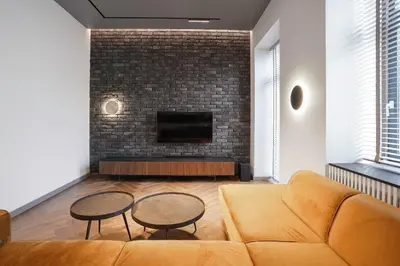 a living room with a couch and two tables at Forentinn Gedimino pr. in Vilnius