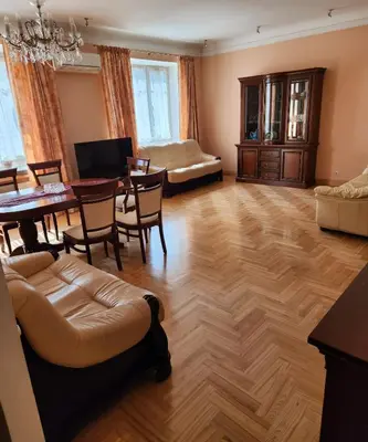 a living room with a table and a couch at HaPPy Inn ArkA the heart of Old Town, Self-Check-in, A-C, Car-Parking, Balkony in Vilnius