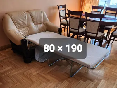 a room with a chair and a table with a sign on it at HaPPy Inn ArkA the heart of Old Town, Self-Check-in, A-C, Car-Parking, Balkony in Vilnius