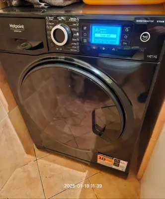 a dishwasher with its door open in a kitchen at HaPPy Inn ArkA the heart of Old Town, Self-Check-in, A-C, Car-Parking, Balkony in Vilnius