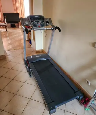 a treadmill sitting in a room with a wall at HaPPy Inn ArkA the heart of Old Town, Self-Check-in, A-C, Car-Parking, Balkony in Vilnius