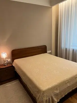 a bedroom with a bed and a window at 101 Large Space in Kaunas