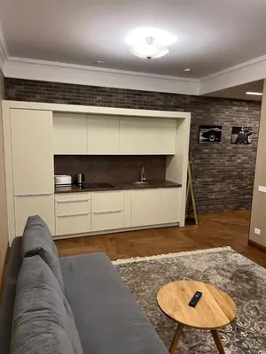 a living room with a couch and a table at 101 Large Space in Kaunas