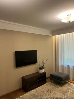 a living room with a flat screen tv on a wall at 101 Large Space in Kaunas