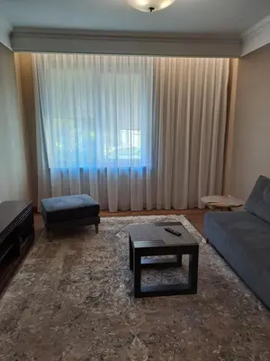 a living room with a couch and a coffee table at 101 Large Space in Kaunas