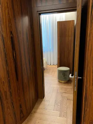 an open door to a room with a wooden floor at 101 Large Space in Kaunas