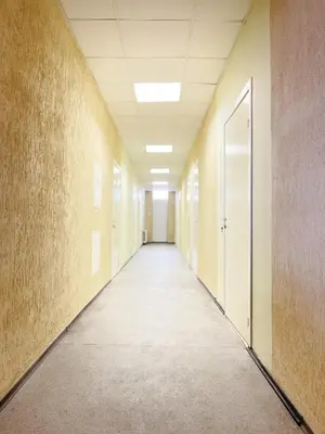 an empty corridor of an office building with a hallway at Apgyvendinimo įstaiga KORNEALITA in Zarasai