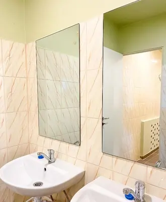 a bathroom with a sink and a mirror at Apgyvendinimo įstaiga KORNEALITA in Zarasai