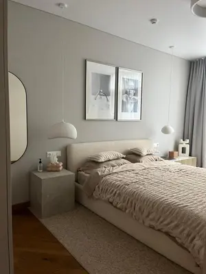a bedroom with a bed and two pictures on the wall at Home in in Druskininkai