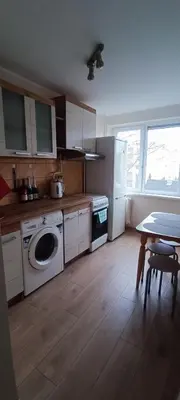 a kitchen with a washer and dryer in it at Adomo Apartamentai Panevėžyje in Panevėžys
