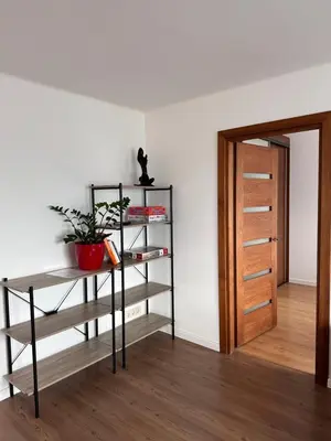 a room with a book shelf and a door at 