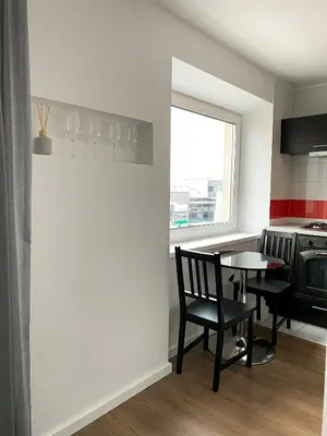 a kitchen with a table and chairs and a window at 