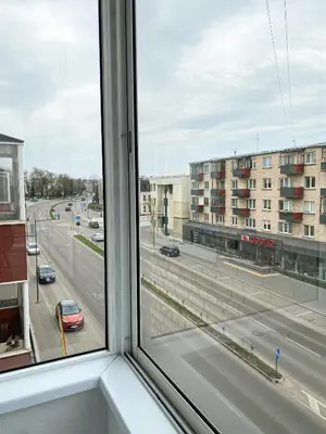 a view of a city street from a window at 