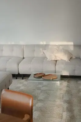 a living room with a couch and a coffee table at Island House atostogų namai in Gaylyunay