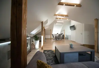 a living room with a couch and a table at Petro studija in Kaunas