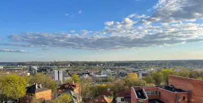 a view of a city under a cloudy sky at Center stay Kaunas - Peledyne - Owl's nest apartments in Kaunas