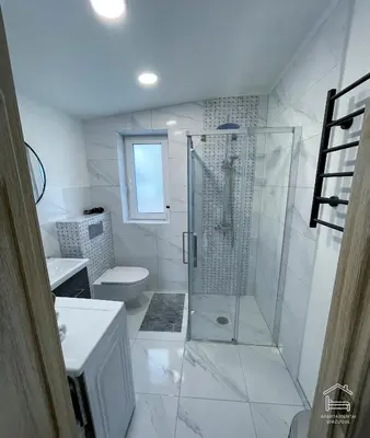 a bathroom with a shower and a toilet at Apartamentai Biržuose, Cozy Modern Bungalows in Biržai