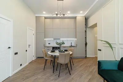 a kitchen and dining room with a table and chairs at FREE PARKING Old Town Central Station Apart with Balcony in Vilnius