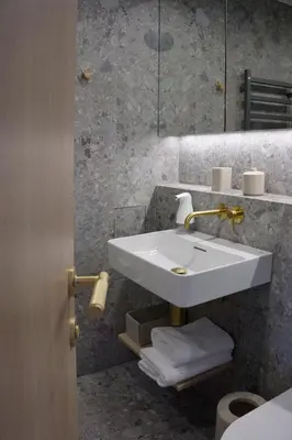 a bathroom with a white sink and a mirror at VANDUO Anykščiuose in Anykščiai