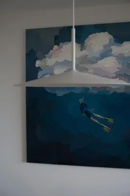a painting of a person swimming in the water at VANDUO Anykščiuose in Anykščiai