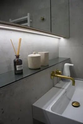 a bathroom counter with a sink and a mirror at SMĖLIS Anykščiuose in Anykščiai